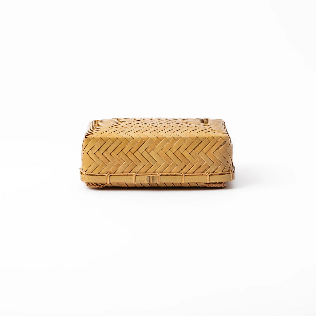Traditional Japanese Ajiro weave bamboo bento box with a fitted lid showing intricate handcrafted diagonal patterns