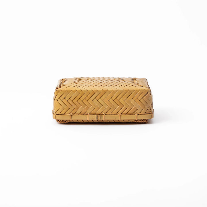 Traditional Japanese Ajiro weave bamboo bento box with a fitted lid showing intricate handcrafted diagonal patterns