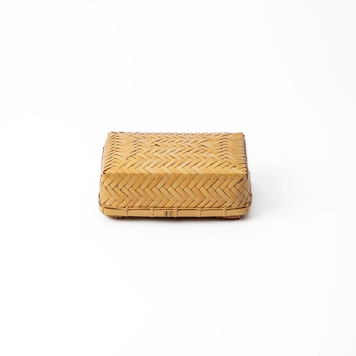Traditional Japanese Ajiro weave bamboo bento box with a fitted lid showing intricate handcrafted diagonal patterns