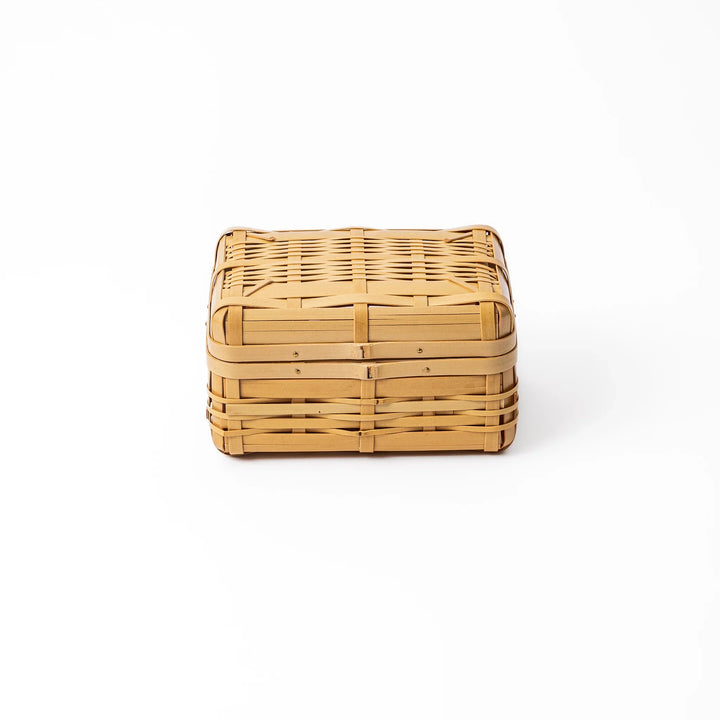 Handcrafted Japanese Hishigi weave bamboo bento basket with lid showing natural flattened bamboo textures