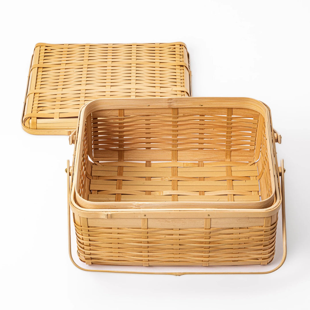 Open Japanese bamboo storage basket with lid showing a spacious interior for organized home storage or picnic meals