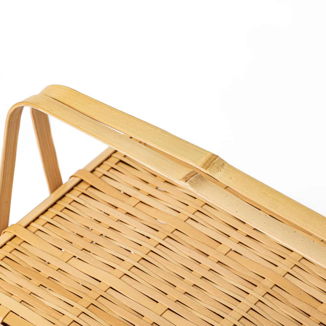 Close up of handcrafted Japanese bamboo basket showing the detailed weave pattern and natural structural durability