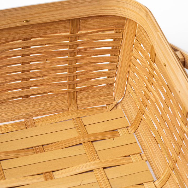 Close up of handcrafted Japanese bamboo basket showing the detailed weave pattern and natural structural durability