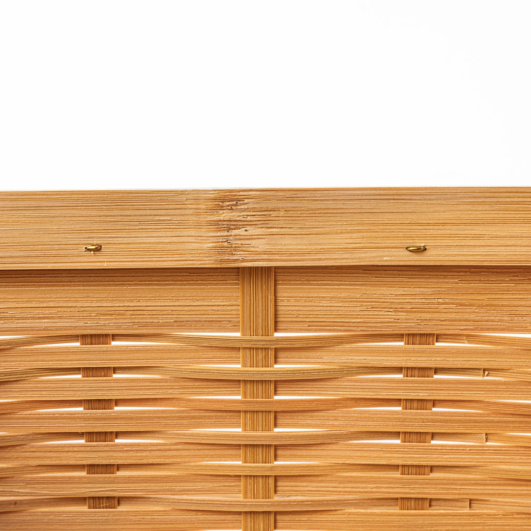 Close up of handcrafted Japanese bamboo basket showing the detailed weave pattern and natural structural durability