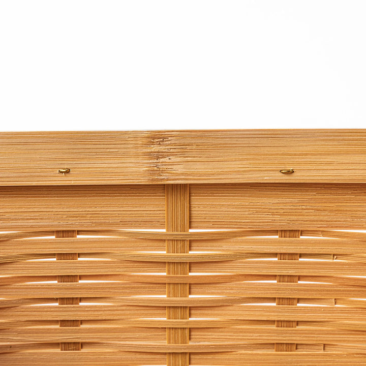 Close up of handcrafted Japanese bamboo basket showing the detailed weave pattern and natural structural durability