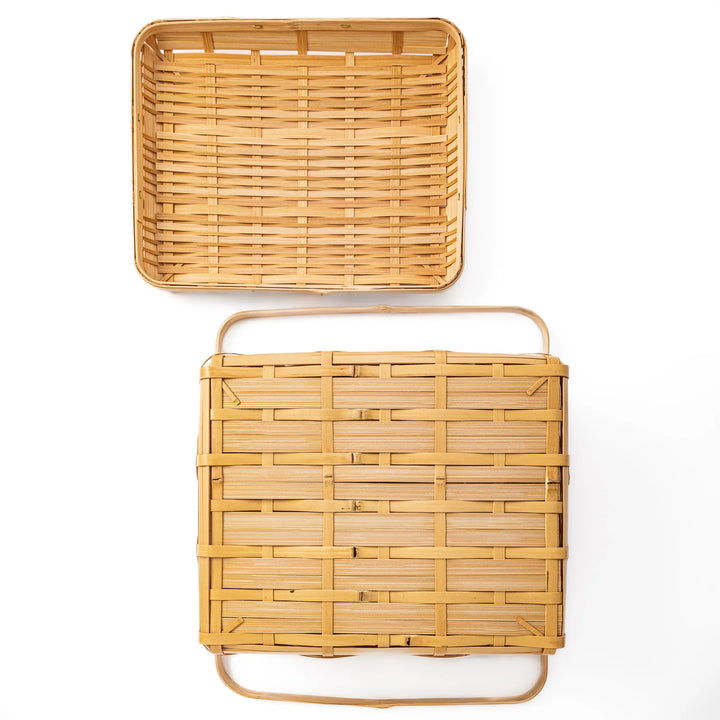 Open Japanese bamboo storage basket with lid showing a spacious interior for organized home storage or picnic meals