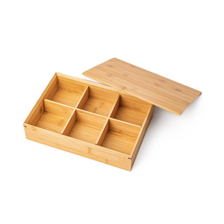 An open six compartment bamboo bento box with its lid placed alongside showcasing the depth and sturdy craftsmanship