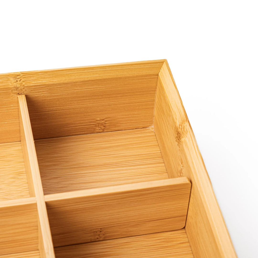 A rectangular bamboo bento box showing a smooth natural wood grain finish and a minimalist eco friendly design
