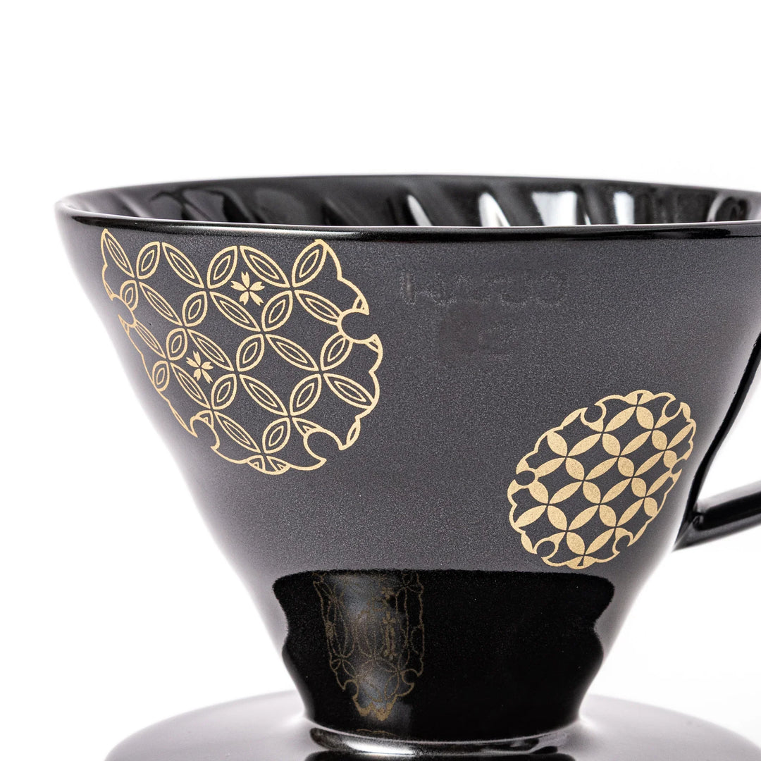 Japanese black ceramic coffee dripper size 02, featuring gold Shippou pattern details for pour over coffee brewing