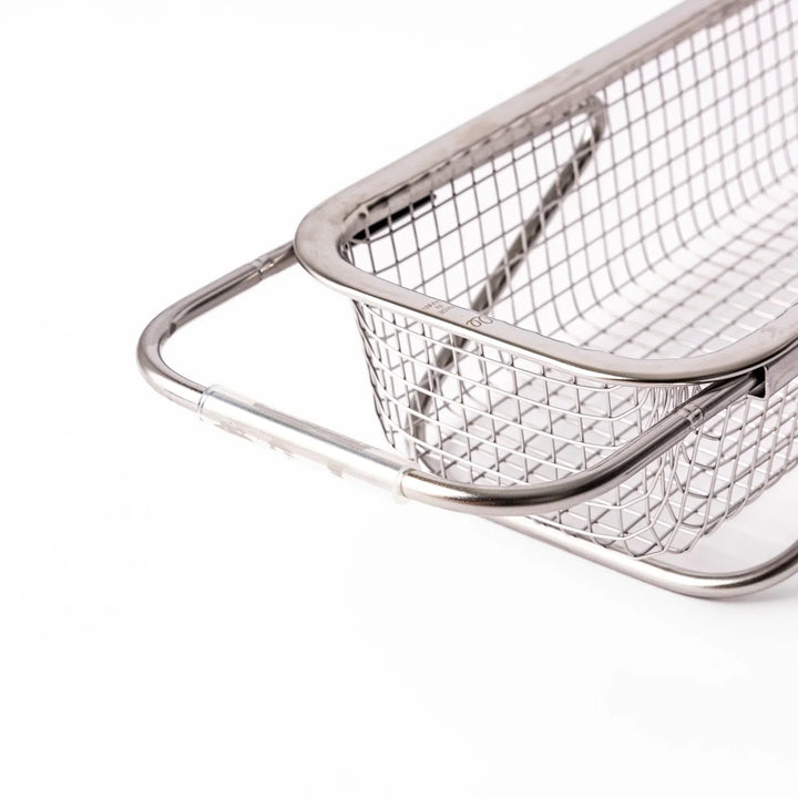 Stainless steel rectangular strainer basket with handles for draining noodles or frying in Japanese cooking.