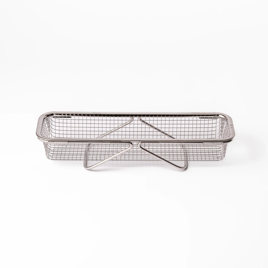 Stainless steel rectangular strainer basket with handles for draining noodles or frying in Japanese cooking.