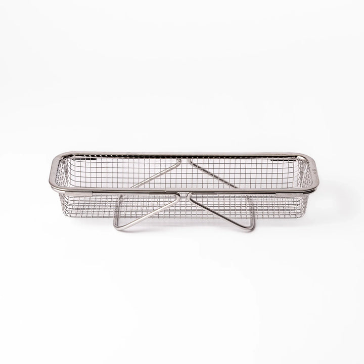 Stainless steel rectangular strainer basket with handles for draining noodles or frying in Japanese cooking.