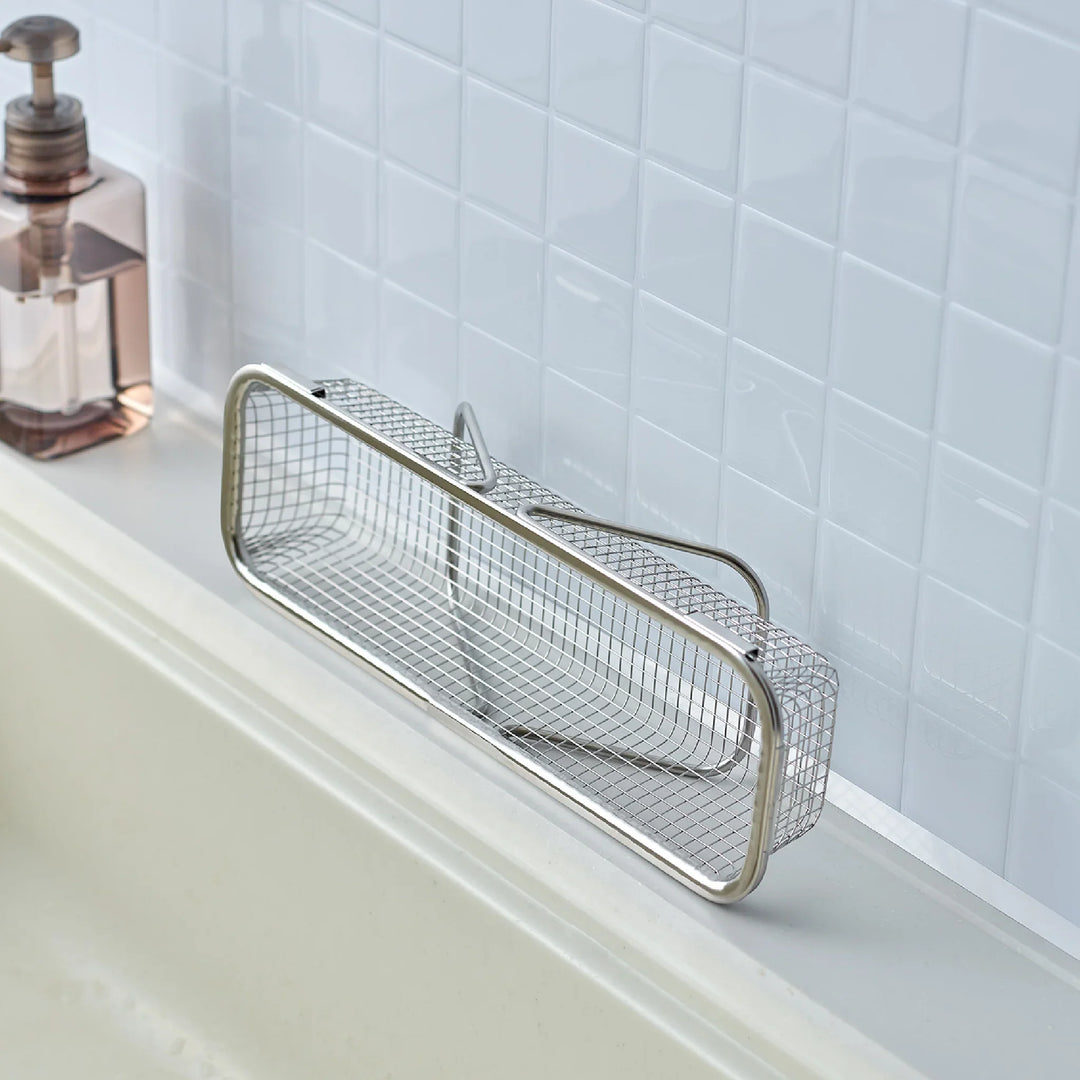 Stainless steel rectangular strainer basket with handles for draining noodles or frying in Japanese cooking.