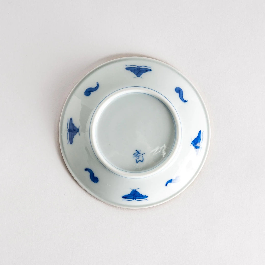 Ceramic plate with blue floral circular motif framed by copper textured rim for elegant Japanese dining.
