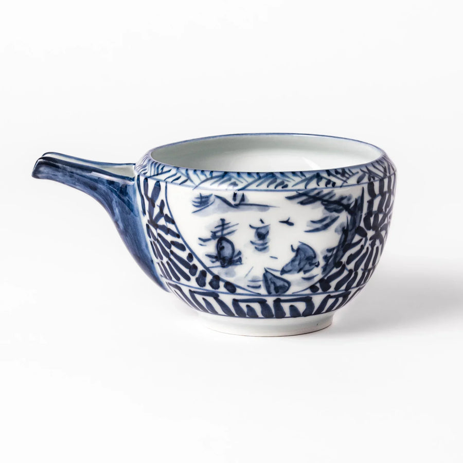 Porcelain sake pourer with spout featuring indigo landscape and arabesque motifs in Japanese tradition.