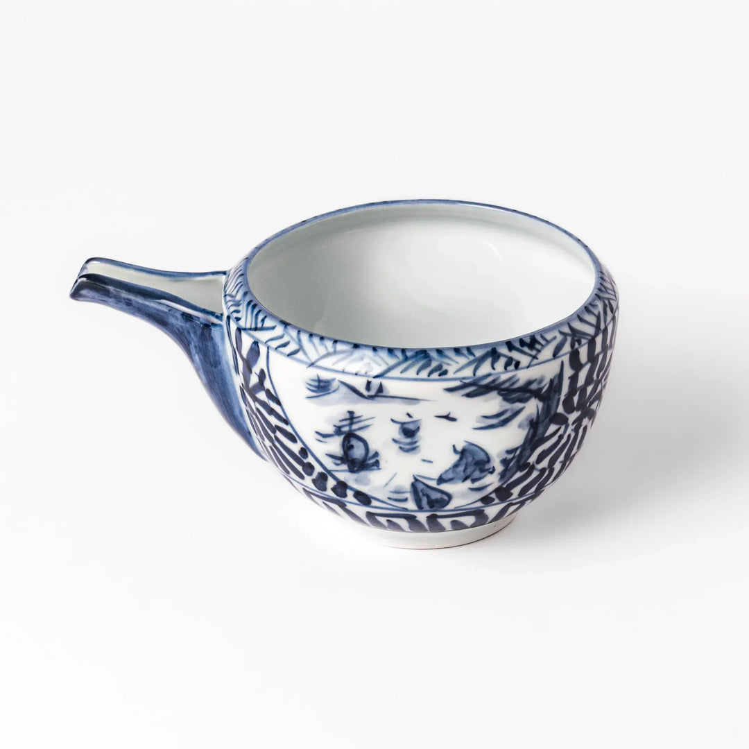 Porcelain sake pourer with spout featuring indigo landscape and arabesque motifs in Japanese tradition.