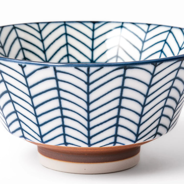 Japanese porcelain rice bowl with indigo arrow feather pattern and terracotta base, handcrafted in traditional style.