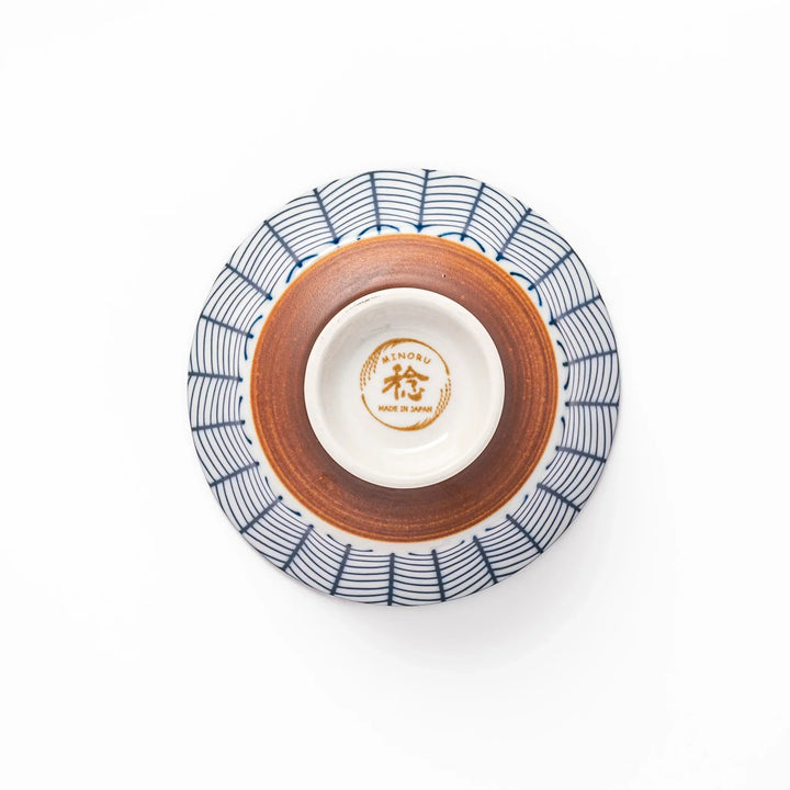 Japanese porcelain rice bowl with indigo arrow feather pattern and terracotta base, handcrafted in traditional style.
