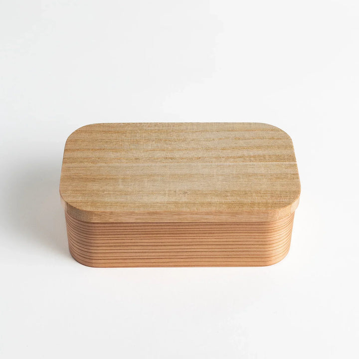 Artisan Cedar Bento Box with smooth wood finish and rounded edges, showcasing its elegant design.