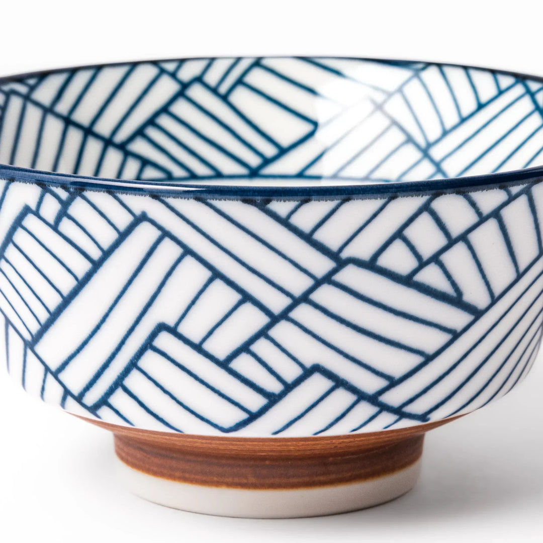Japanese porcelain rice bowl with indigo basket weave pattern and terracotta base, crafted in traditional style.