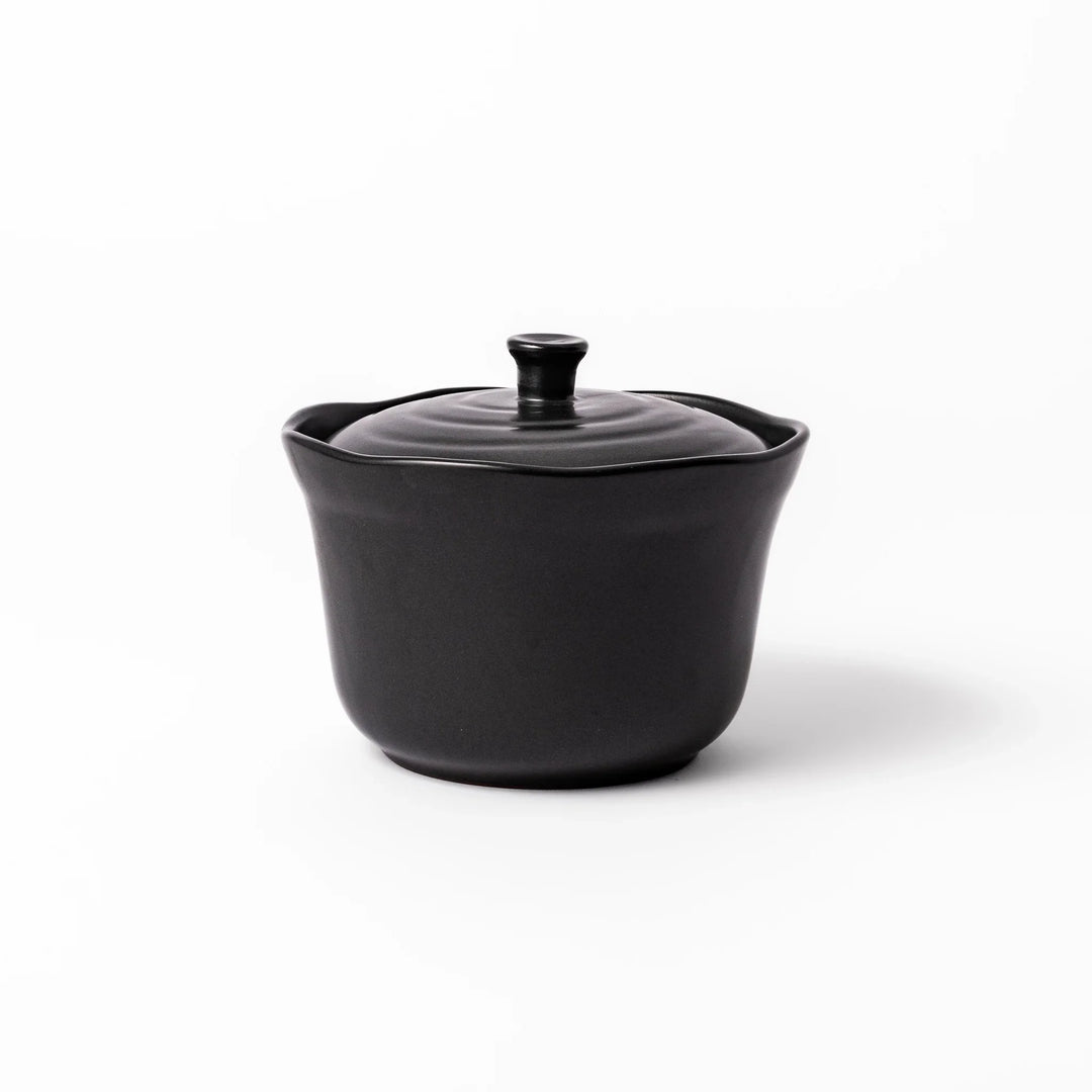 Black ceramic rice storage bowl with floral ridge lid design, compact size for storing cooked rice and keeping it warm.