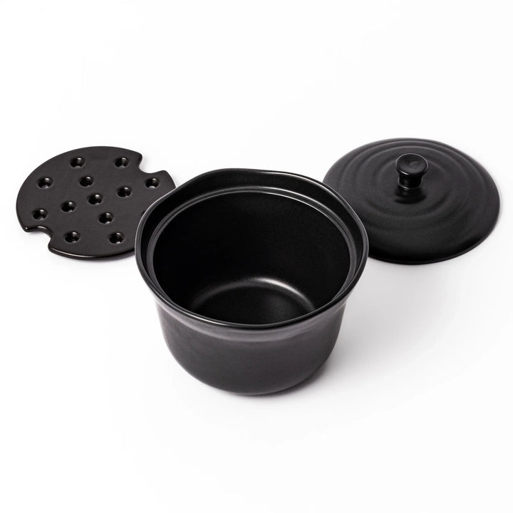 Black ceramic rice storage bowl with floral ridge lid design, compact size for storing cooked rice and keeping it warm.