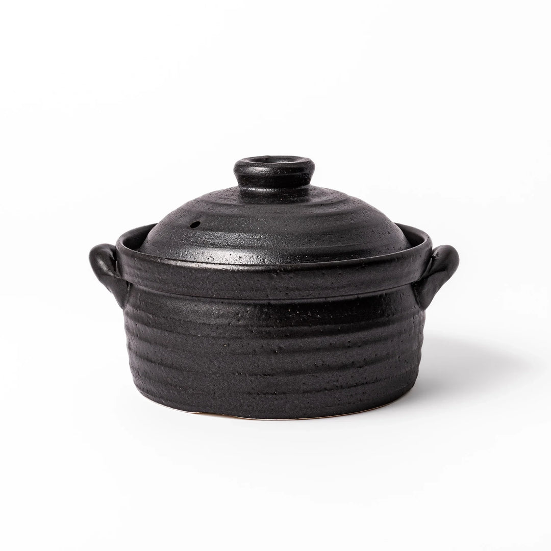 Black clay donabe with induction-compatible design, featuring double lid and side handles, ideal for cooking 2 cups of rice.