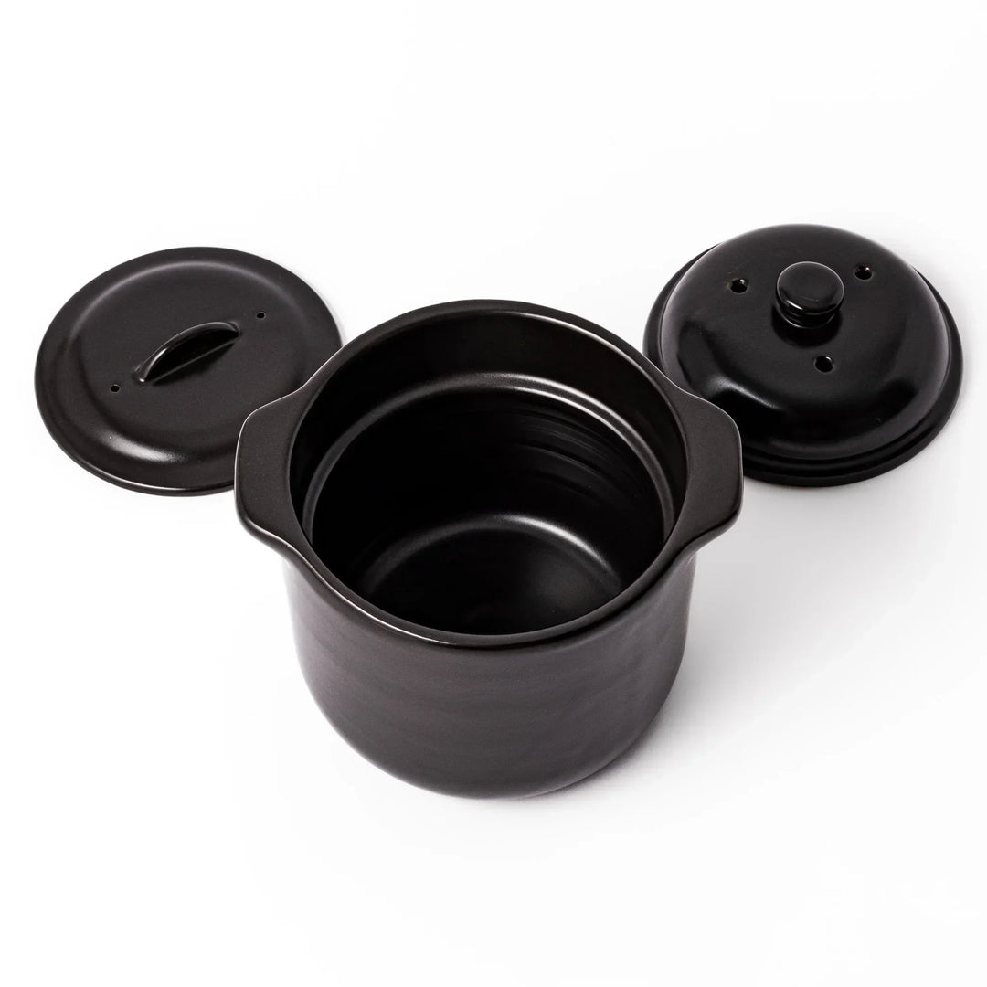 Black ceramic microwave rice cooker with double lid and handles for convenient cooking and table serving.
