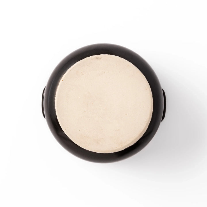 Black ceramic microwave rice cooker with double lid and handles for convenient cooking and table serving.