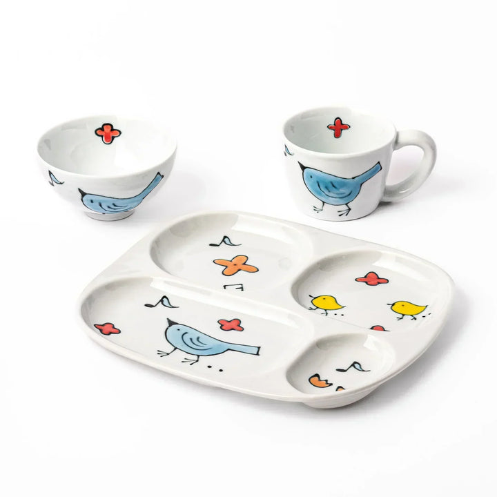 Blue Bird Kids Dinnerware Set with divided plate, rice bowl, and mug, decorated with cheerful bird motifs.