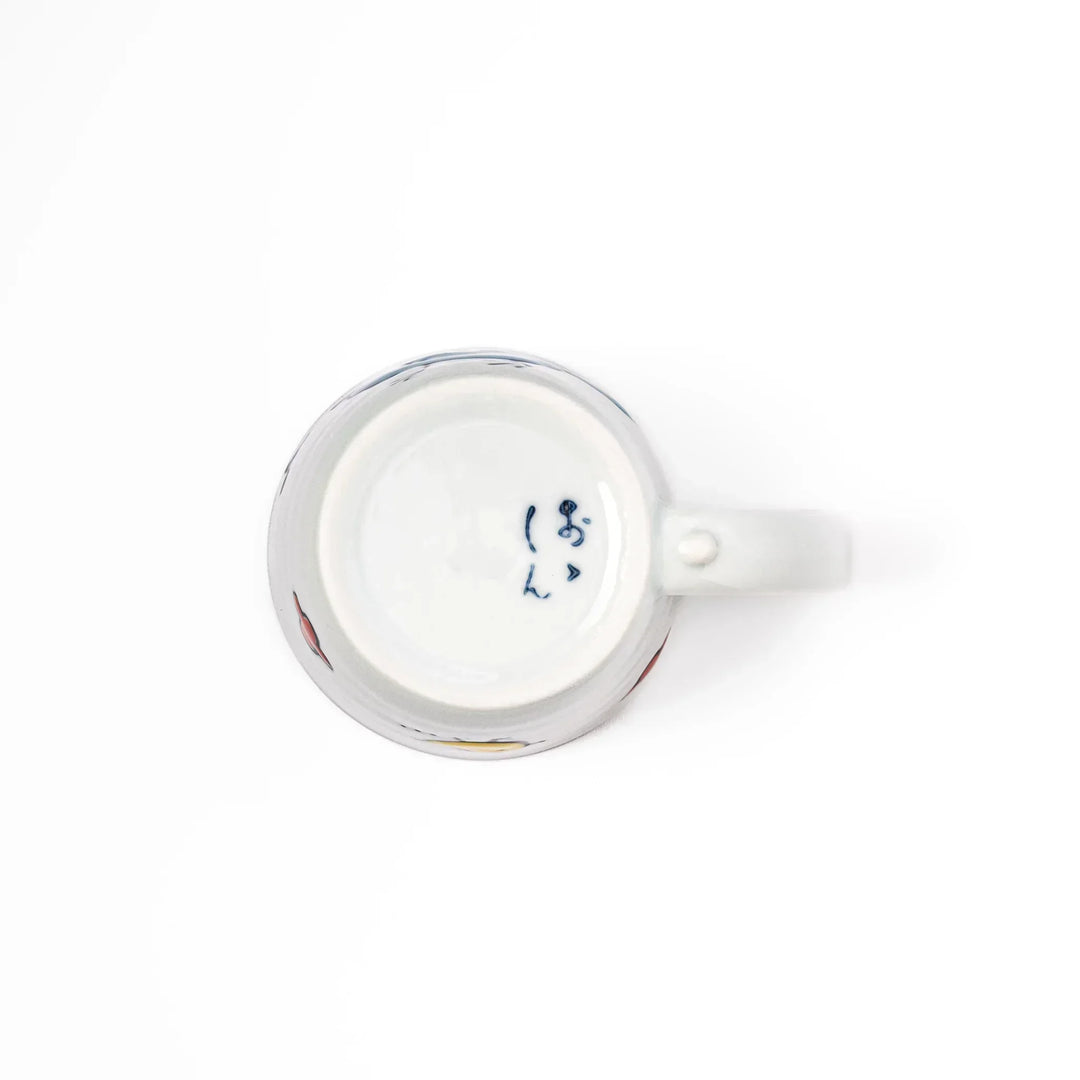 Children’s mug with hand-painted blue bird and musical notes, crafted from white porcelain for joyful sips.