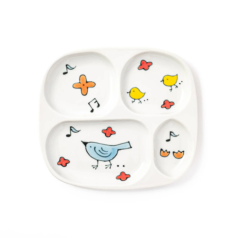 Children’s divided plate with blue and yellow birds, flowers, and notes, designed for fun, easy mealtime organization.