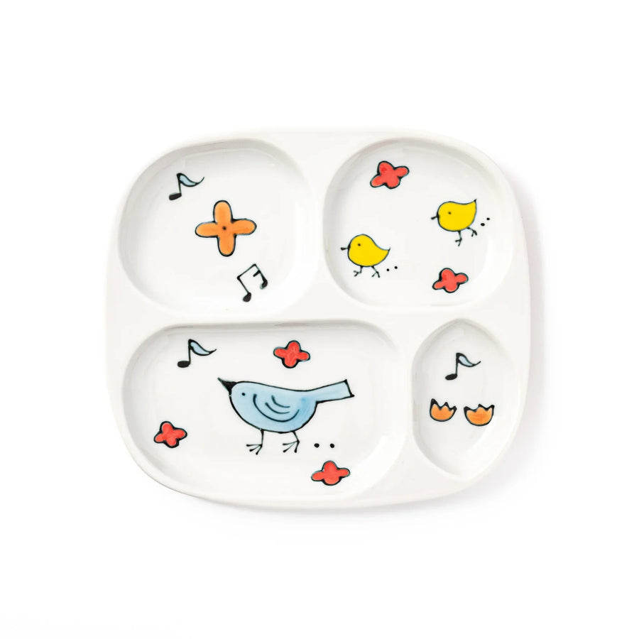 Children’s divided plate with blue and yellow birds, flowers, and notes, designed for fun, easy mealtime organization.