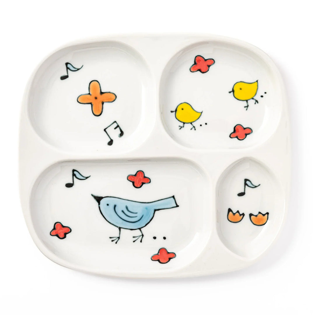 Children’s divided plate with blue and yellow birds, flowers, and notes, designed for fun, easy mealtime organization.