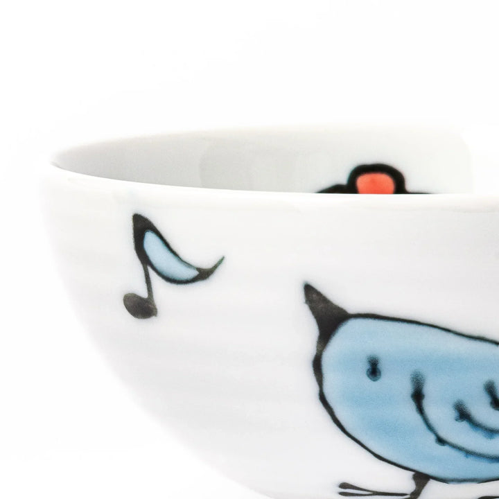 Children’s rice bowl with hand-painted blue bird and musical notes, adding cheer to everyday meals.