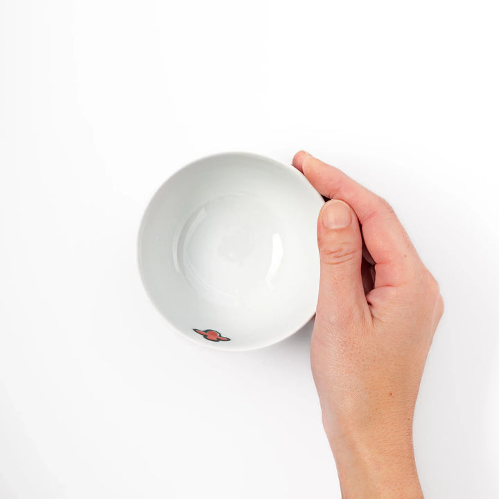 Children’s rice bowl with hand-painted blue bird and musical notes, adding cheer to everyday meals.
