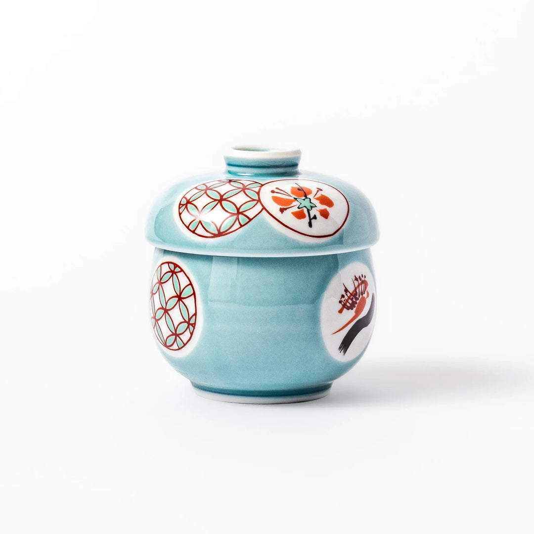 Lidded chawanmushi bowl with a glossy blue glaze and traditional red, black, and white circular patterns on lid and sides.