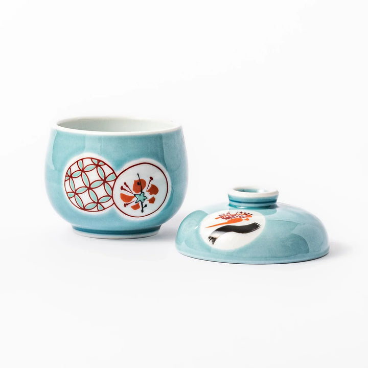 Lidded chawanmushi bowl with a glossy blue glaze and traditional red, black, and white circular patterns on lid and sides.