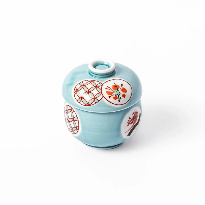 Lidded chawanmushi bowl with a glossy blue glaze and traditional red, black, and white circular patterns on lid and sides.