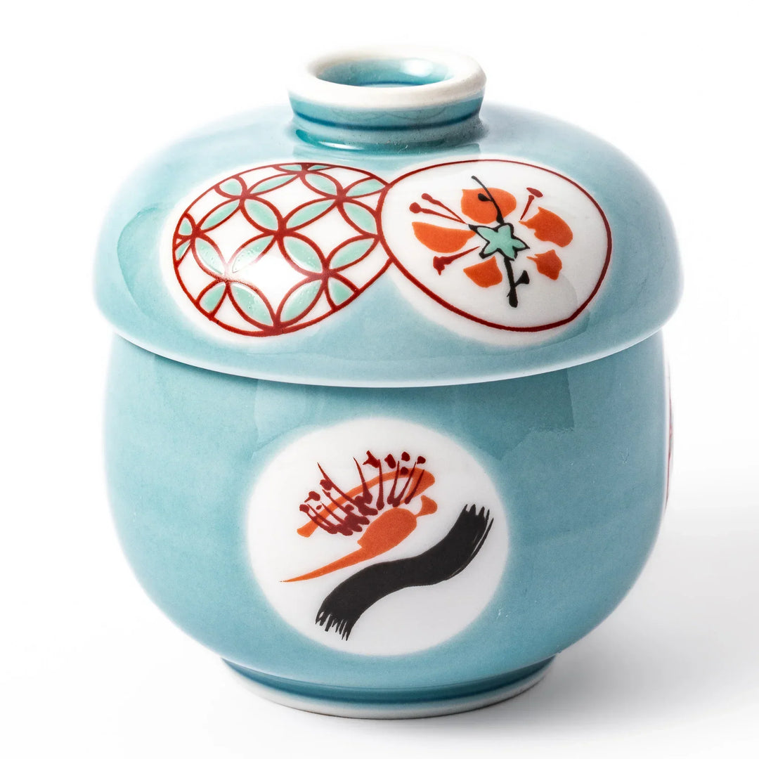 Lidded chawanmushi bowl with a glossy blue glaze and traditional red, black, and white circular patterns on lid and sides.