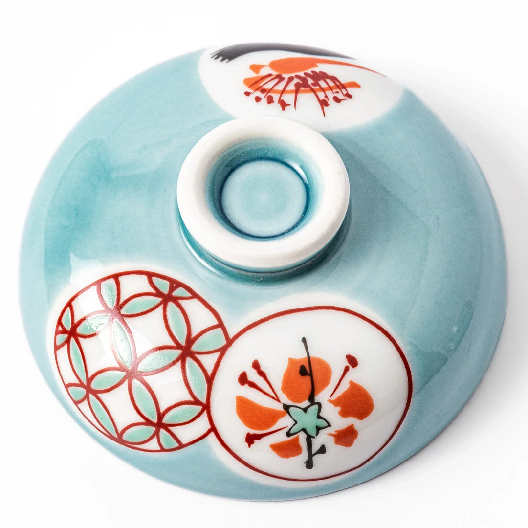 Lidded chawanmushi bowl with a glossy blue glaze and traditional red, black, and white circular patterns on lid and sides.