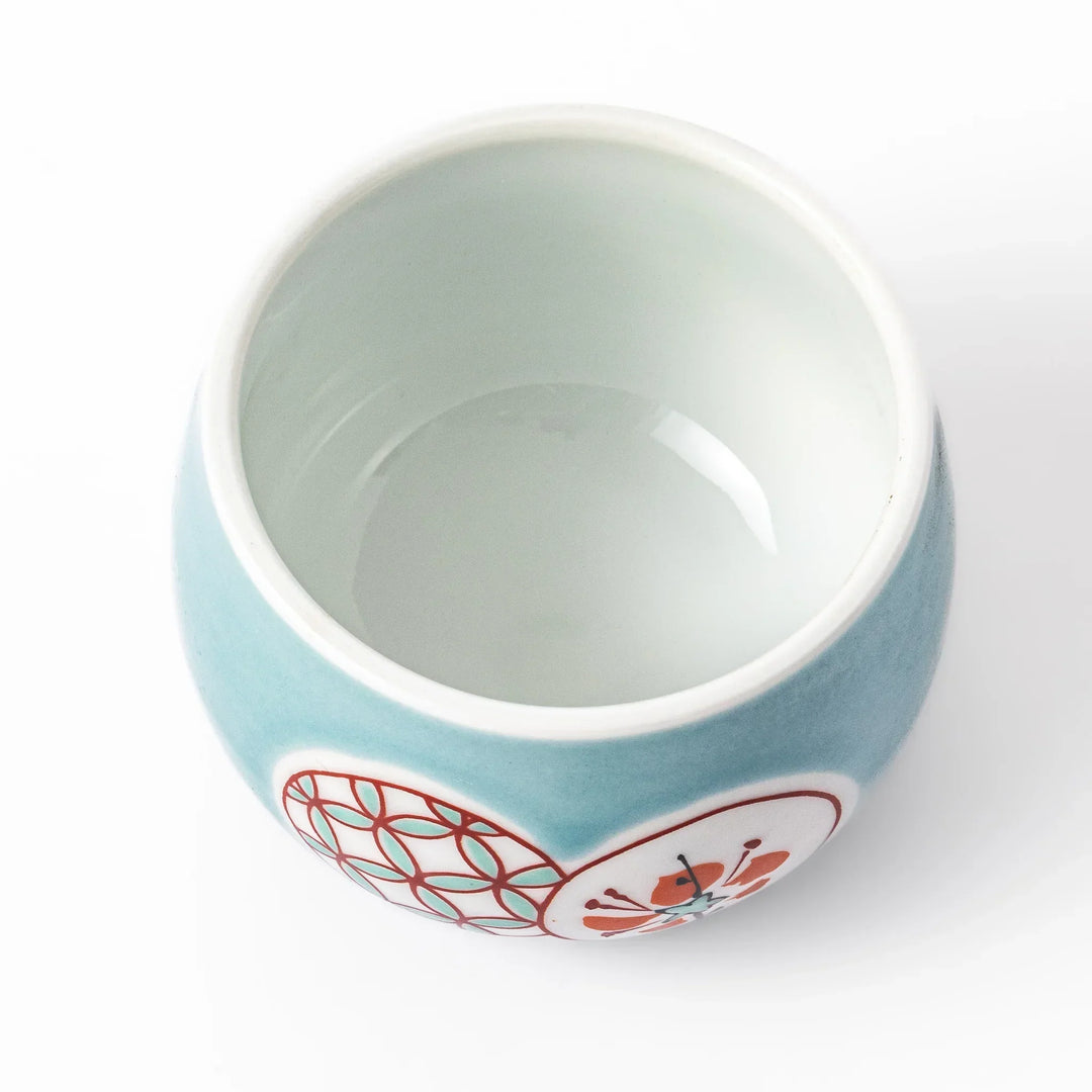 Lidded chawanmushi bowl with a glossy blue glaze and traditional red, black, and white circular patterns on lid and sides.