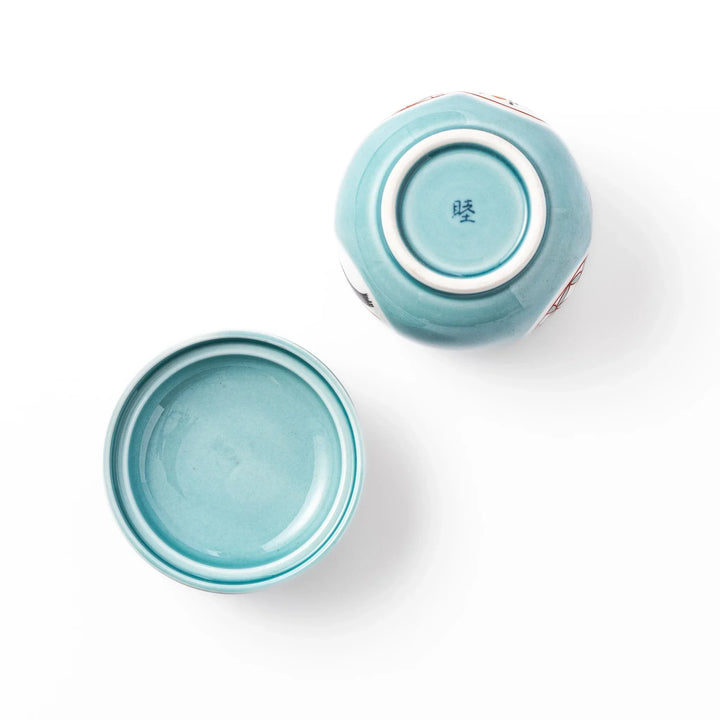 Lidded chawanmushi bowl with a glossy blue glaze and traditional red, black, and white circular patterns on lid and sides.