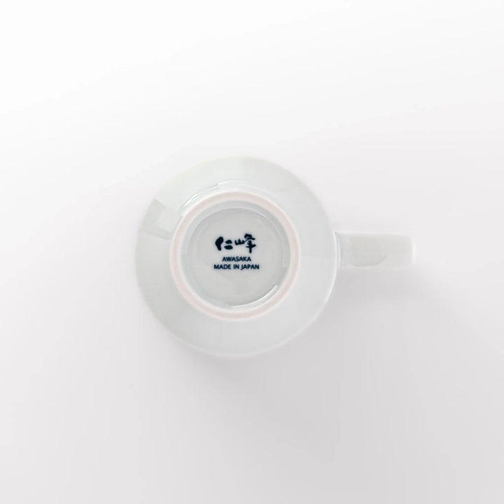 Japanese porcelain mug featuring Hokusai Great Wave and red-blue geometric patterns, crafted with elegant traditional design.