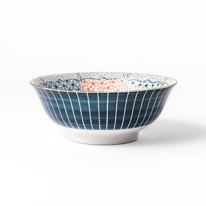 Japanese porcelain ramen bowl featuring Hokusai Great Wave design with red and blue geometric patterns in traditional style.