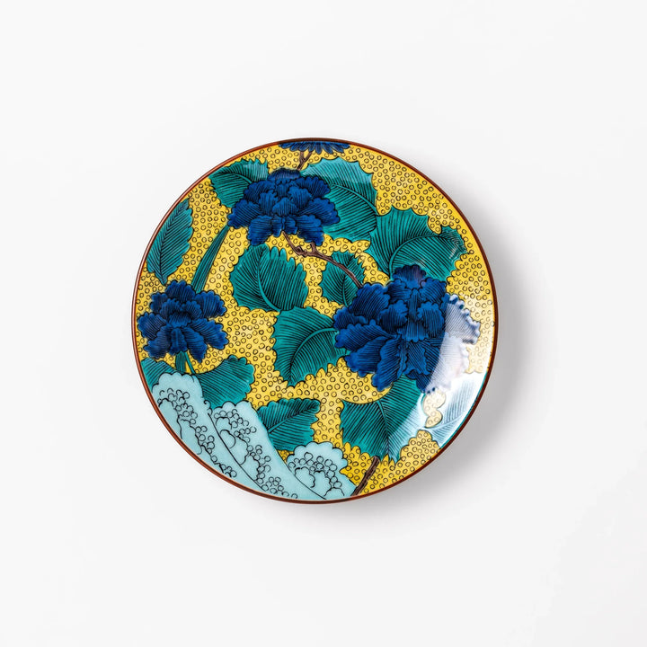 Japanese porcelain dessert plate with blue peony flowers green leaves and golden yellow background.