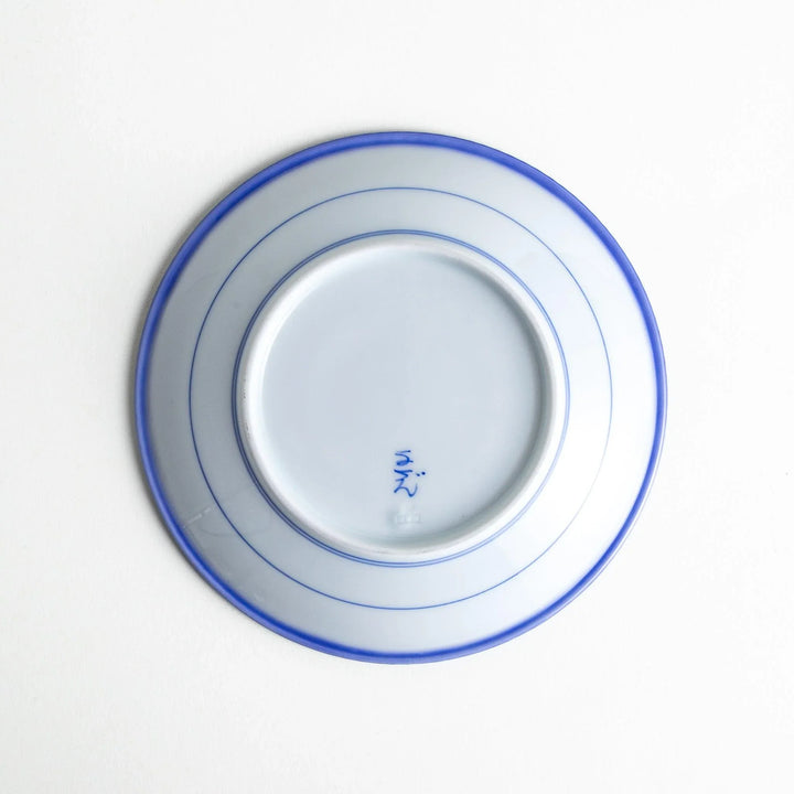 A round white dessert plate with a rustic scallop-edged border. The border comes in blue, brown, and olive.