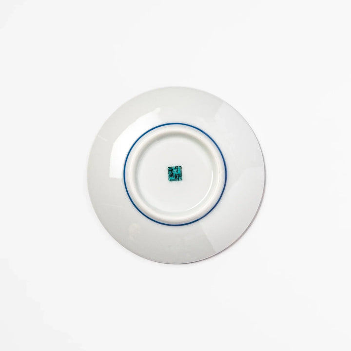 Blue Japanese ceramic sauce dish with white sakura blossom design for serving soy sauce or condiments.