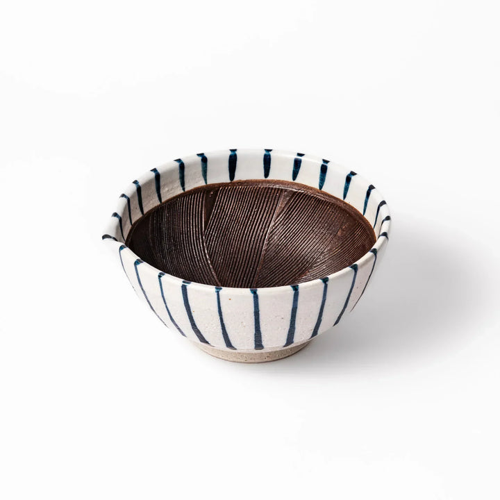 White ceramic suribachi mortar with blue stripes and brown textured interior for grinding sesame seeds.