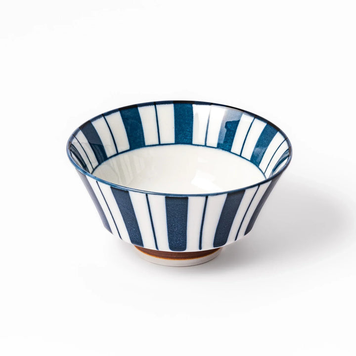 Japanese porcelain rice bowl with bold indigo and white stripes and terracotta base in modern classic style.
